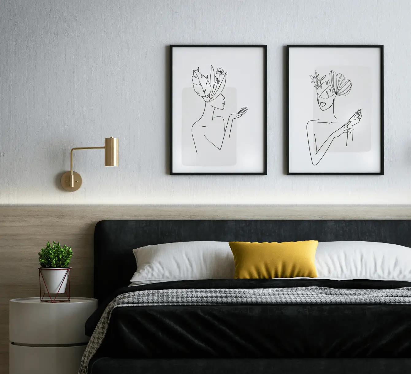 A modern bedroom with a black bed, two framed line art prints, and a plant on a nightstand.